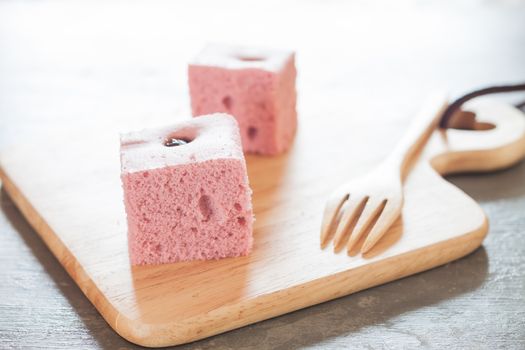 Steamed cake on wooden plate, stock photo