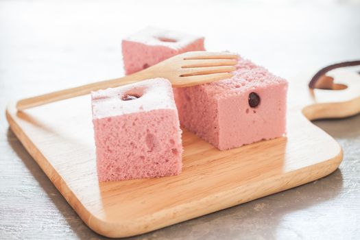 Steamed cake on wooden plate, stock photo