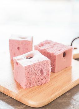 Steamed cake on wooden plate, stock photo