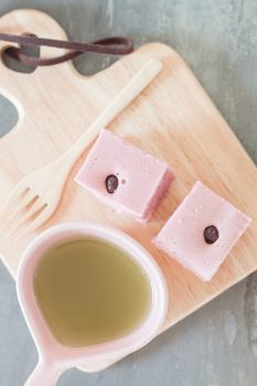 Steamed cake on wooden plate, stock photo