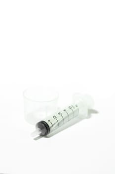 Medium feeding syringe on white background, stock photo