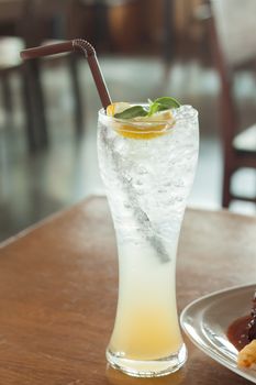 Glass of iced honey lemon soda, stock photo