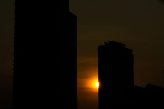 silhouette sunset at building in city 