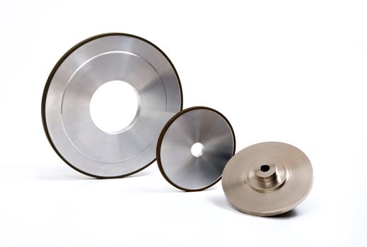Industrial grinding and polishing wheels on white background