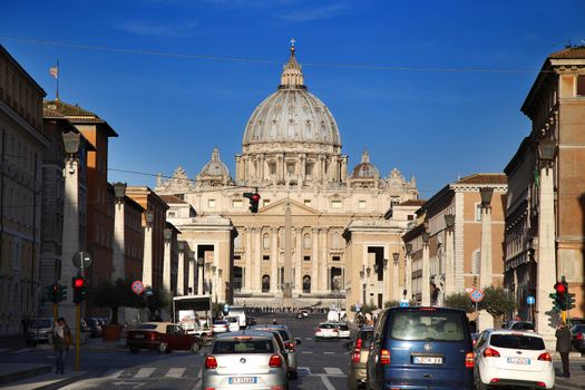 ROME, ITALY - APRIL 02: Urban scene and many tourists visiting Basilica of St. Peter in the Vatican, Rome, Italy on April 02, 2015.