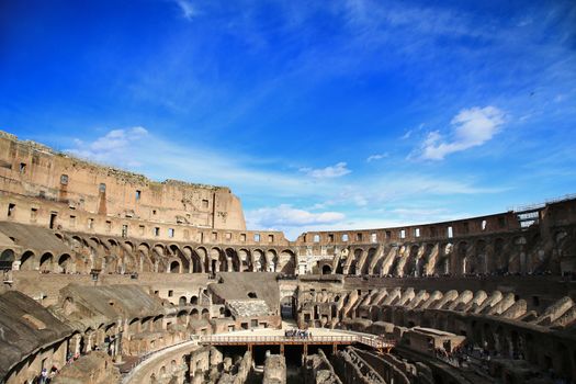 ROME; ITALY - APRIL 08: Ruins of the Colloseum and tourists in Rome; Italy. Rome is the capital of Italy and region of Lazio. Italy on April 08; 2015.