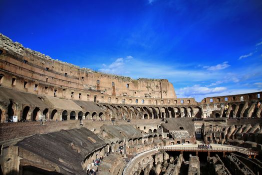 ROME; ITALY - APRIL 08: Ruins of the Colloseum and tourists in Rome; Italy. Rome is the capital of Italy and region of Lazio. Italy on April 08; 2015.