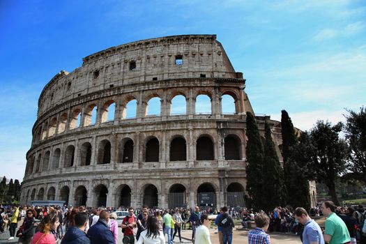 ROME, ITALY - APRIL 08: Many tourists visiting The Colosseum in Rome, Italy. Rome is the capital of Italy and region of Lazio. Italy on April 08, 2015.