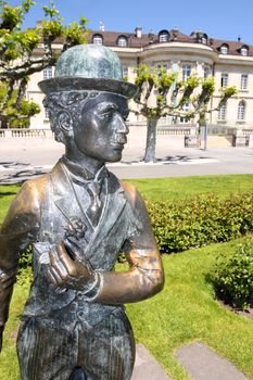 VEVEY, SWITZERLAND - 24 MAY: Bronze statue of comedian actor Charlie Chaplin on the promenade in Vevey (Vaud), Switzerland on May 24,2010.