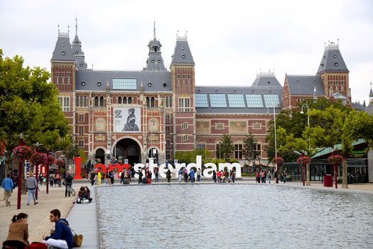 AMSTERDAM, THE NETHERLANDS - AUGUST 18, 2015: View on Rijksmuseum (National state museum) with words, popular touristic destination in Amsterdam, Netherlands. Amsterdam is capital of the Netherlands on August 18, 2015.