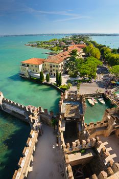 Sirmione, province of Brescia, Lombardy, northern Italy, 15th August 2016: people visiting the medieval castle Scaliger on lake Lago di Garda