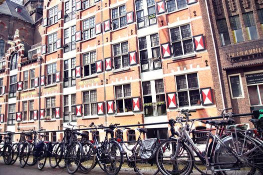 AMSTERDAM; THE NETHERLANDS - AUGUST 19; 2015: View on Oudezijds Kolk canal in Amsterdam, building Verf en Vernis Fabriek H.Vettewinke in Amsterdam. Amsterdam is capital of the Netherlands on August 19; 2015.