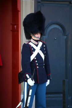 COPENHAGEN, DENMARK - AUGUST 15, 2016: Danish Royal Life Guard on the central plaza of Amalienborg palace, home of the Danish Royal family in Copenhagen, Denmark on August 15, 2016.