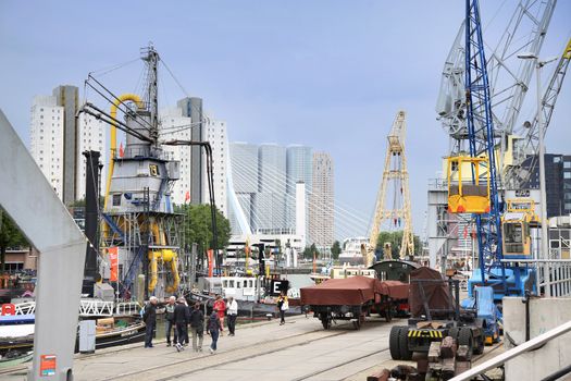 ROTTERDAM, THE NETHERLANDS - 18 AUGUST: People around Maritime Museum in Historical Leuvehaven, Rotterdam's oldest sea port. Harbor and modern apartment buildings in Rotterdam, Netherlands on August 18,2015.