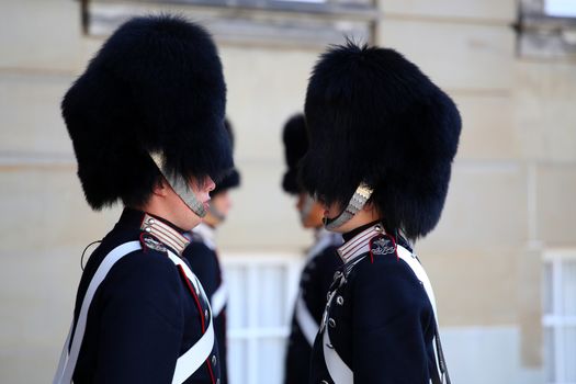 COPENHAGEN, DENMARK - AUGUST 15, 2016: Danish Royal Life Guards line up for the changing of the guards on the central plaza of Amalienborg palace in Copenhagen, Denmark on August 15, 2016.