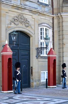 COPENHAGEN, DENMARK - AUGUST 15, 2016: Danish Royal Life Guards on the central plaza of Amalienborg palace, home of the Danish Royal family in Copenhagen, Denmark on August 15, 2016.