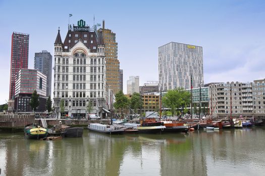 ROTTERDAM, THE NETHERLANDS - 18 AUGUST: Rotterdam is a city modern architecture, Westermeijer Tower and Oude Haven oldest part of the harbour in Rotterdam, Netherlands on August 18,2015.