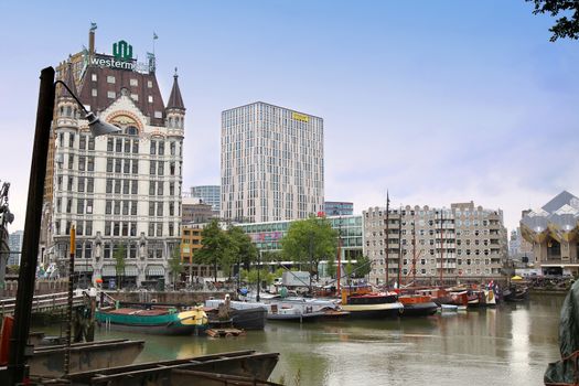 ROTTERDAM, THE NETHERLANDS - 18 AUGUST: Rotterdam is a city modern architecture, Westermeijer Tower and Oude Haven oldest part of the harbour in Rotterdam, Netherlands on August 18,2015.