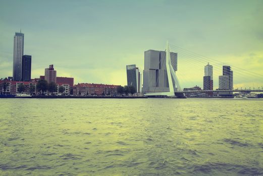 ROTTERDAM, THE NETHERLANDS - 18 AUGUST: Rotterdam is a city modern architecture, view on Erasmus Bridge and skyline of Rotterdam, river Maas in Rotterdam, Netherlands on August 18,2015.