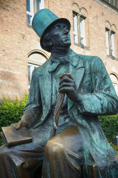 Monument of Hans Christian Andersen standing next to Radhus, Copenhagen city hall, Copenhagen, Denmark