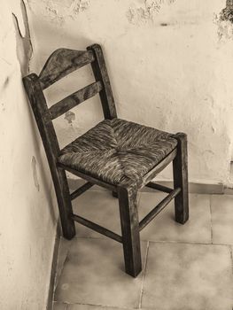 Old wooden chair in abandoned room