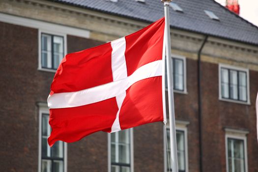Waving Danish flag on the mast in Copenhagen, Denmark
