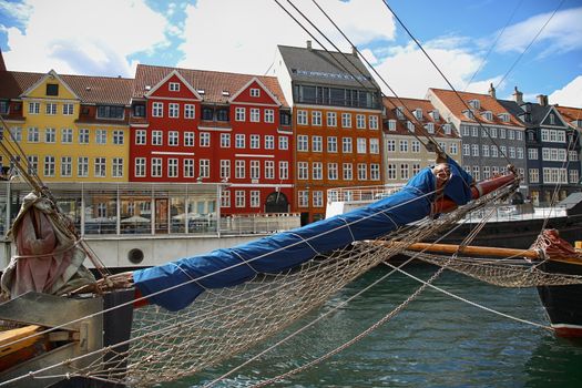 Yacht and color houses in seafront Nyhavn (new Harbor) in Copenhagen, Denmark