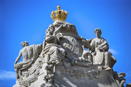 Statues on top marble bridge, Christiansborg palace gates in Copenhagen, Denmark