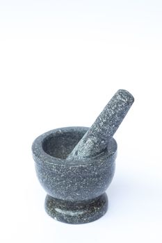 Stone mortar and pestle on white background, stock photo