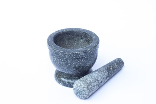 Stone mortar and pestle on white background, stock photo