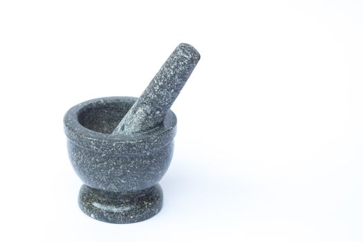 Stone mortar and pestle on white background, stock photo