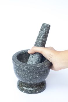 Stone mortar and pestle on white background, stock photo