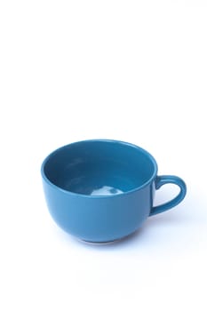 Blue ceramic bowl on white background, stock photo