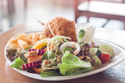 Deep chicken fried with salad, stock photo