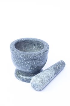 Stone mortar and pestle on white background, stock photo