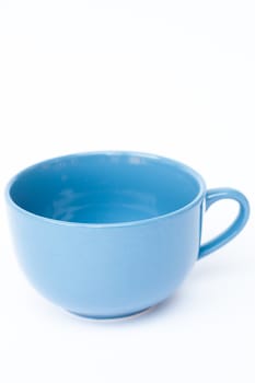 Blue ceramic bowl on white background, stock photo