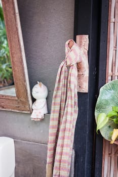 Clean cotton napkin in front of toilet, stock photo