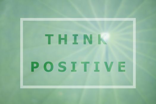 Think positive word inspirational quote on green leaf background