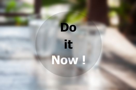 Do it now inspirational quote on blurred background