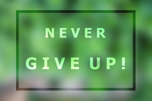 Never give up inspirational quote on blurred background