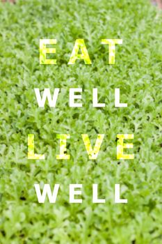 Eat well live well inspirational quote on vegetable background