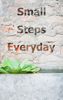 Small steps everyday inspirational quote, stock photo