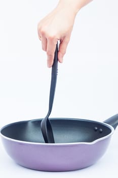 Hand with non stick frying pan on white background, stock photo