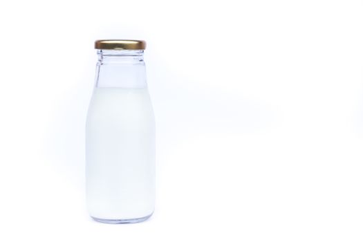Traditional glass milk bottle on white background, stock photo