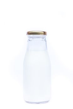 Traditional glass milk bottle on white background, stock photo