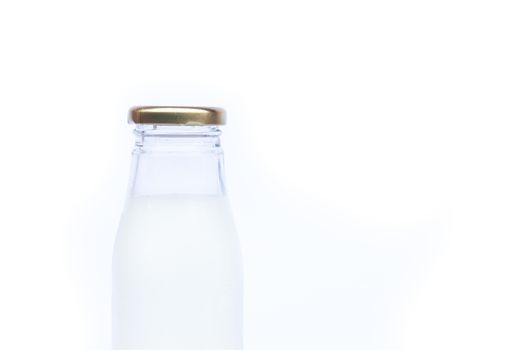 Traditional glass milk bottle on white background, stock photo