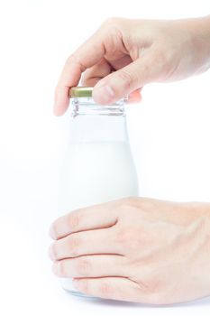 Woman hand open traditional glass milk bottle, stock photo