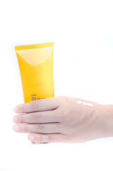 Woman pouring body lotion on hand on white background