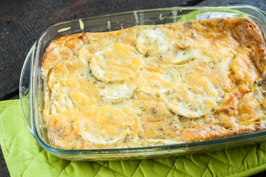 casserole of zucchini squash in a glass form.