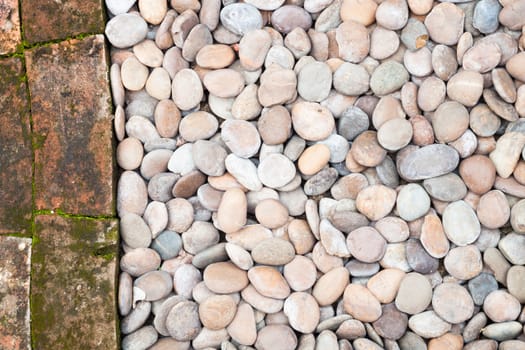 Pebble stones and bricks abstract background, stock photo